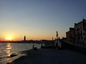sun sets over venice
